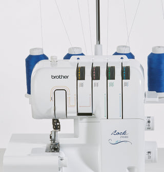 Brother 2104D Overlocker with Blind stitch foot, Piping foot and Gathering Foot