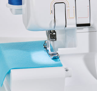 Brother 2104D Overlocker with Blind stitch foot, Piping foot and Gathering Foot