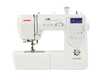 Janome M200 QDC Sewing Machine - includes auto thread cut, extension table, hard cover.